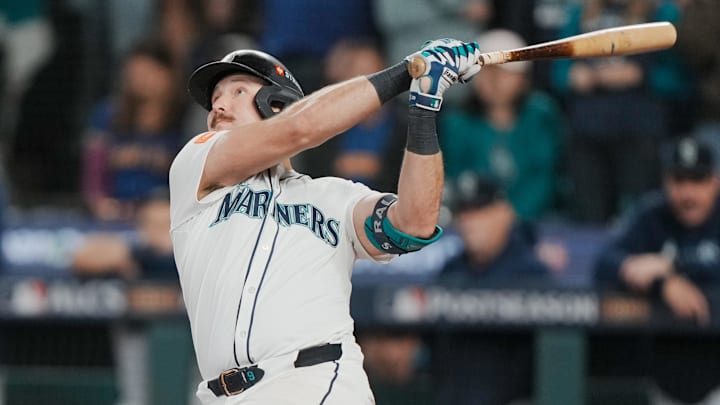 Oct 17, 2025; Seattle, Washington, USA; Seattle Mariners catcher Cal Raleigh (29) hits a solo home run against the Toronto Blue Jays in the eighth inning during game five of the ALCS round for the 2025 MLB playoffs at T-Mobile Park. Mandatory Credit: Stephen Brashear-Imagn Images