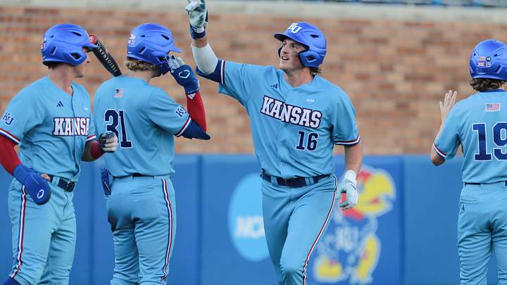 Kansas senior Josh Dykhoff (16) signals to the crowd after hitting a home run against Arkansas during the NCAA regional tournament at Hoglund Ballpark in Lawrence, Kansas, on May 31, 2026.