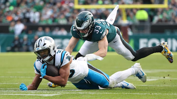 Dec 8, 2024; Philadelphia, Pennsylvania, USA;  Philadelphia Eagles cornerback Cooper DeJean (33) and Carolina Panthers running back Chuba Hubbard (30) in action at Lincoln Financial Field. Mandatory Credit: Bill Streicher-Imagn Images