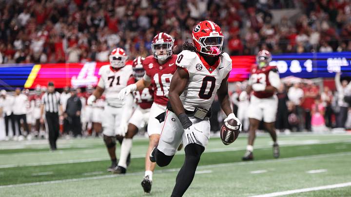 Dec 6, 2025; Atlanta, GA, USA; Georgia Bulldogs running back Roderick Robinson II (0) scores a touchdown during the first quarter against the Alabama Crimson Tide during the 2025 SEC Championship game at Mercedes-Benz Stadium. Mandatory Credit: Brett Davis-Imagn Images