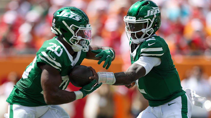 Sep 21, 2025; Tampa, Florida, USA; New York Jets quarterback Tyrod Taylor (2) hands off to running back Breece Hall (20) against the Tampa Bay Buccaneers in the second quarter at Raymond James Stadium. 