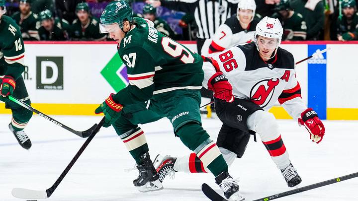 Minnesota Wild left wing Kirill Kaprizov (97) protects the puck from New Jersey Devils center Jack Hughes (86) during the second period at Xcel Energy Center. Mandatory Credit: Brace Hemmelgarn-USA TODAY Sports Minnesota Wild left wing Kirill Kaprizov (97) protects the puck from New Jersey Devils center Jack Hughes (86) during the second period at Xcel Energy Center. Mandatory Credit: Brace Hemmelgarn-USA TODAY Sports