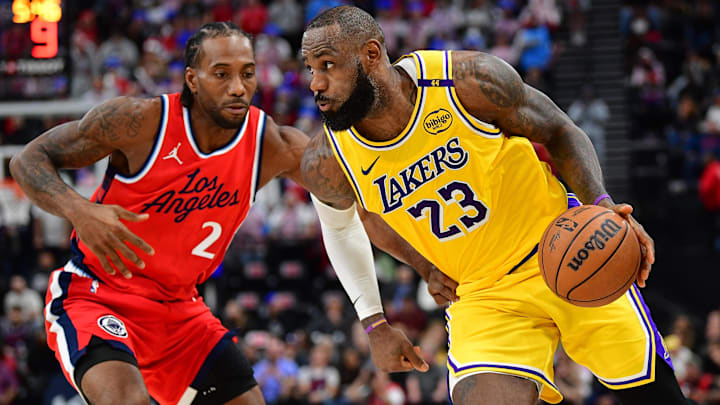 Feb 4, 2025; Inglewood, California, USA; Los Angeles Lakers forward LeBron James (23) moves the ball against Los Angeles Clippers forward Kawhi Leonard (2) during the second half at Intuit Dome. Mandatory Credit: Gary A. Vasquez-Imagn Images Feb 4, 2025; Inglewood, California, USA; Los Angeles Lakers forward LeBron James (23) moves the ball against Los Angeles Clippers forward Kawhi Leonard (2) during the second half at Intuit Dome. Mandatory Credit: Gary A. Vasquez-Imagn Images