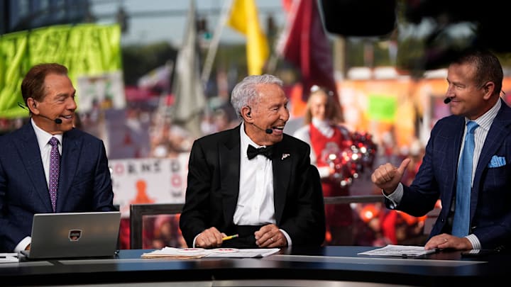 Lee Corso, middle, talks to Kirk Herbstreit, right, and Nick Saban on the set of ESPN College GameDay prior to the NCAA football game between the Ohio State Buckeyes and the Texas Longhorns at Ohio Stadium on Aug. 30, 2025.