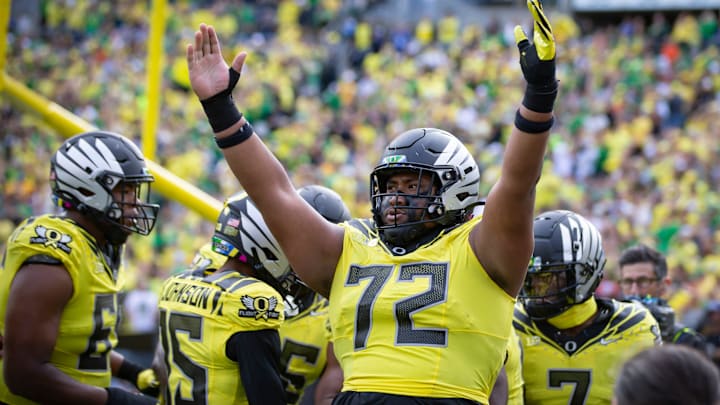 Oregon offensive lineman Iapani Laloulu celebrates a touchdown by Oregon running back Noah Whittington as the No. 1 Oregon Ducks host the No. 21 Illinois Fighting Illini Saturday, Oct. 26, 2024 at Autzen Stadium in Eugene, Ore. Oregon offensive lineman Iapani Laloulu celebrates a touchdown by Oregon running back Noah Whittington as the No. 1 Oregon Ducks host the No. 21 Illinois Fighting Illini Saturday, Oct. 26, 2024 at Autzen Stadium in Eugene, Ore.