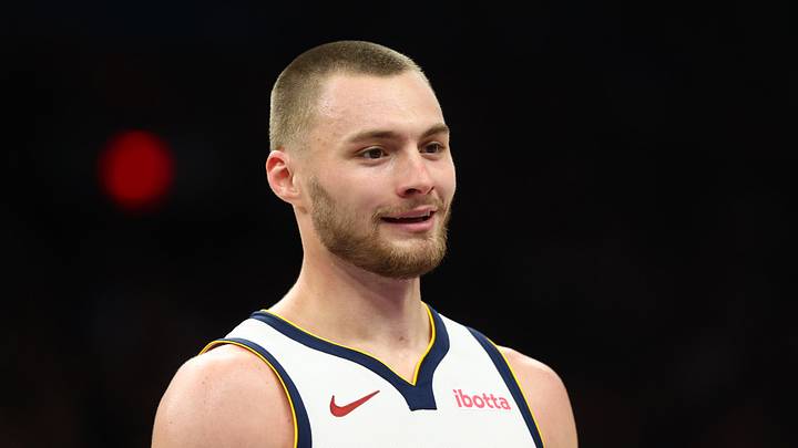 Mar 24, 2026; Phoenix, Arizona, USA; Denver Nuggets guard Christian Braun (0) against the Phoenix Suns at Mortgage Matchup Center. Mandatory Credit: Mark J. Rebilas-Imagn Images