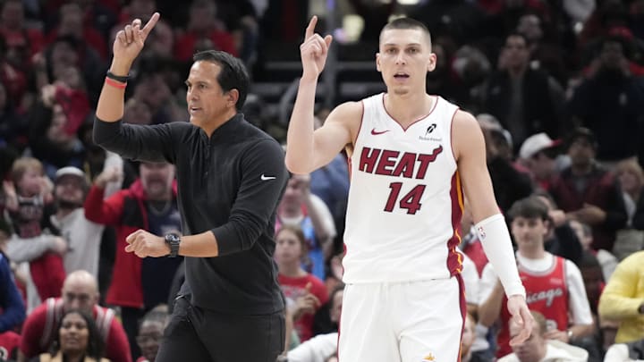 Apr 16, 2025; Chicago, Illinois, USA; Miami Heat guard Tyler Herro (14) and head coach Erik Spoelstra ask for a replay against the Chicago Bulls during the second half at United Center. Mandatory Credit: David Banks-Imagn Images
