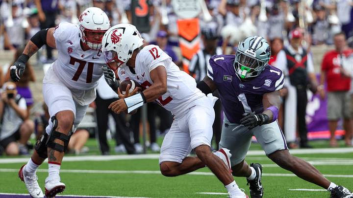 Kansas State Wildcats defensive end Wendell Gregory (1) tries to tackle Washington State Cougars quarterback Caden Pinnick (12) during the fourth quarter at Bill Snyder Family Football Stadium. Kansas State Wildcats defensive end Wendell Gregory (1) tries to tackle Washington State Cougars quarterback Caden Pinnick (12) during the fourth quarter at Bill Snyder Family Football Stadium.