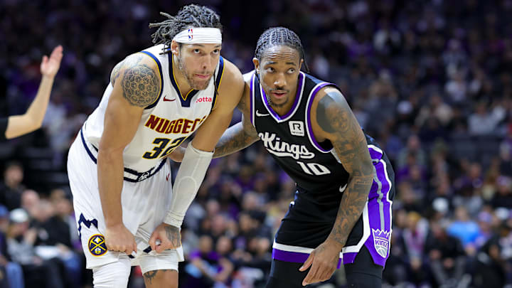 Dec 16, 2024; Sacramento, California, USA; Denver Nuggets forward Aaron Gordon (32) and Sacramento Kings forward DeMar DeRozan (10) during the second quarter at Golden 1 Center. Mandatory Credit: Sergio Estrada-Imagn Images