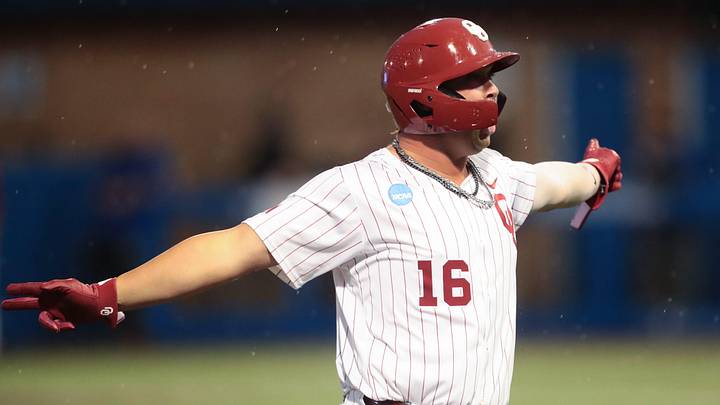 Oklahoma Sooners Dayton Tockey (16) yells out after scoring a home run against Kansas Jayhawks during the NCAA Lawrence Super Regional game at Hoglund Ballpark on June 7, 2026.