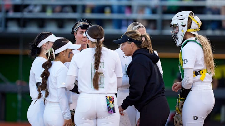 Oregon head coach Melyssa Lombardi meets with players as the Oregon Ducks host the Ohio State Buckeyes on April 24, 2026, at Jane Sanders Stadium in Eugene, Oregon.
