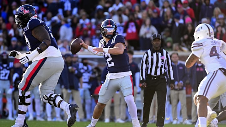 Nov 29, 2024; Oxford, Mississippi, USA; Mississippi Rebels quarterback Jaxson Dart (2) looks to pass while defended by Mississippi State Bulldogs linebacker Branden Jennings (44) during the first quarter at Vaught-Hemingway Stadium. Mandatory Credit: Matt Bush-Imagn Images Nov 29, 2024; Oxford, Mississippi, USA; Mississippi Rebels quarterback Jaxson Dart (2) looks to pass while defended by Mississippi State Bulldogs linebacker Branden Jennings (44) during the first quarter at Vaught-Hemingway Stadium. Mandatory Credit: Matt Bush-Imagn Images