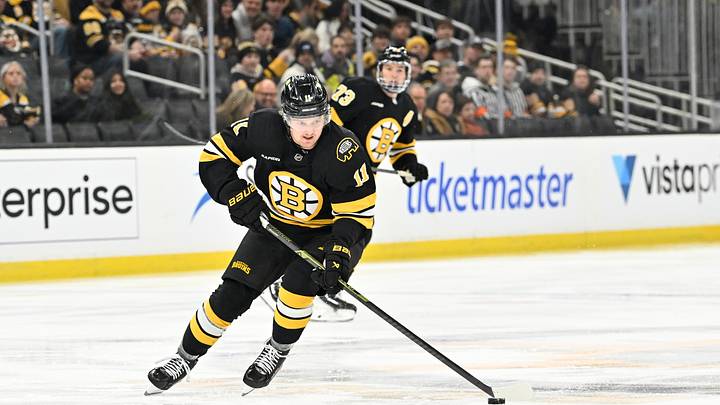 Dec 16, 2025; Boston, Massachusetts, USA; Boston Bruins center Casey Mittelstadt (11) carries the puck through the neutral zone during the first period against the Utah Mammoth at TD Garden. Mandatory Credit: Eric Canha-Imagn Images