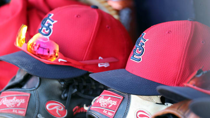 Mar 6, 2019; Tampa, FL, USA; St. Louis Cardinals hat and gloves lay in the dugout at George M. Steinbrenner Field. Mandatory Credit: Kim Klement-Imagn Images