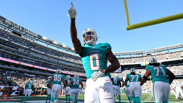 Miami Dolphins running back Ollie Gordon II (0) celebrates after running for a one-yard touchdown against the New York Jets during the first half at MetLife Stadium. Mandatory Credit: Vincent Carchietta-Imagn Images Miami Dolphins running back Ollie Gordon II (0) celebrates after running for a one-yard touchdown against the New York Jets during the first half at MetLife Stadium. Mandatory Credit: Vincent Carchietta-Imagn Images