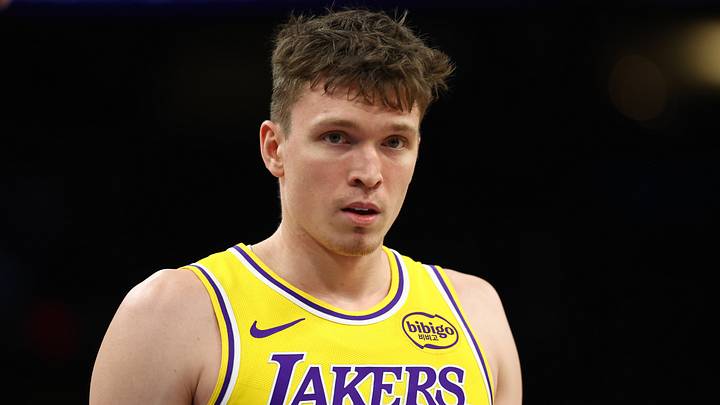 Dec 23, 2025; Phoenix, Arizona, USA; Los Angeles Lakers forward Dalton Knecht (4) against the Phoenix Suns at Mortgage Matchup Center. Mandatory Credit: Mark J. Rebilas-Imagn Images