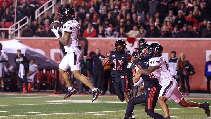 Nov 1, 2025; Salt Lake City, Utah, USA; Cincinnati Bearcats defensive back Tre Gola-Callard (6) intercepts a pass intended for Utah Utes tight end JJ Buchanan (81) during the second half at Rice-Eccles Stadium. Mandatory Credit: Rob Gray-Imagn Images Nov 1, 2025; Salt Lake City, Utah, USA; Cincinnati Bearcats defensive back Tre Gola-Callard (6) intercepts a pass intended for Utah Utes tight end JJ Buchanan (81) during the second half at Rice-Eccles Stadium. Mandatory Credit: Rob Gray-Imagn Images