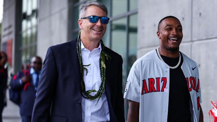 Oct 19, 2024; Tucson, Arizona, USA; Arizona Wildcats head coach Brent Brennan walks with honorary captain Khalil Tate down the Wildcat Walk before the game against Colorado Buffaloes at Arizona Stadium. Oct 19, 2024; Tucson, Arizona, USA; Arizona Wildcats head coach Brent Brennan walks with honorary captain Khalil Tate down the Wildcat Walk before the game against Colorado Buffaloes at Arizona Stadium.