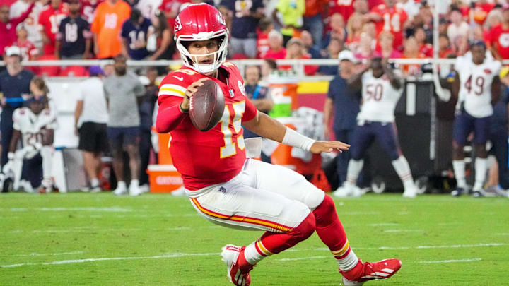 Aug 22, 2025; Kansas City, Missouri, USA; Kansas City Chiefs quarterback Patrick Mahomes (15) runs for a first down against the Chicago Bears during the first half of the game at GEHA Field at Arrowhead Stadium. Mandatory Credit: Denny Medley-Imagn Images