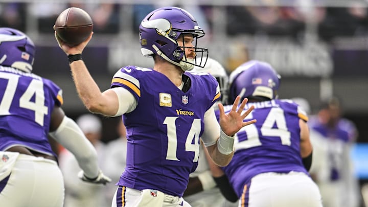 Dec 1, 2024; Minneapolis, Minnesota, USA; Minnesota Vikings quarterback Sam Darnold (14) throws a pass against the Arizona Cardinals during the first quarter at U.S. Bank Stadium. 