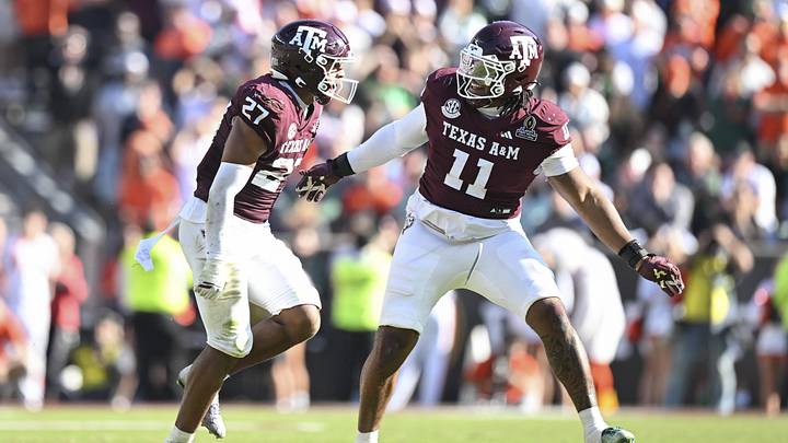 Dec 20, 2025; College Station, TX, USA; Texas A&M Aggies linebacker Daymion Sanford (27) reacts with defensive tackle Tyler Onyedim (11) after recovering a fumble against the Miami Hurricanes during the second half of the first round game of the CFP National Playoff at Kyle Field. Mandatory Credit: Maria Lysaker-Imagn Images Dec 20, 2025; College Station, TX, USA; Texas A&M Aggies linebacker Daymion Sanford (27) reacts with defensive tackle Tyler Onyedim (11) after recovering a fumble against the Miami Hurricanes during the second half of the first round game of the CFP National Playoff at Kyle Field. Mandatory Credit: Maria Lysaker-Imagn Images