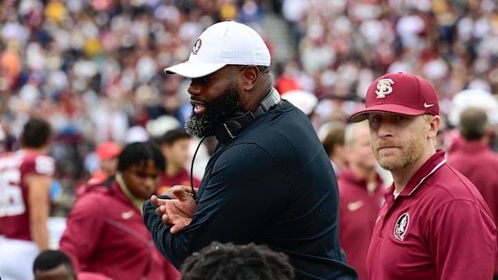 Sep 16, 2023; Chestnut Hill, Massachusetts, USA; Florida State Seminoles offensive coordinator Alex Atkins speaks to the team during the second half against the Boston College Eagles at Alumni Stadium. Mandatory Credit: Eric Canha-Imagn Images