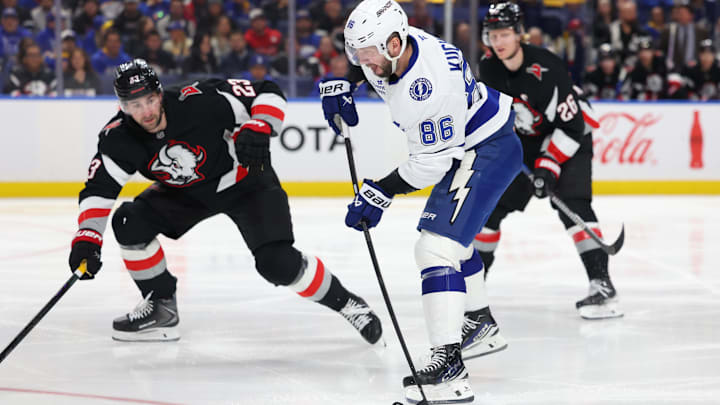 Apr 6, 2026; Buffalo, New York, USA;  Buffalo Sabres defenseman Mattias Samuelsson (23) looks to block a shot by Tampa Bay Lightning right wing Nikita Kucherov (86) during the third period at KeyBank Center. Mandatory Credit: Timothy T. Ludwig-Imagn Images