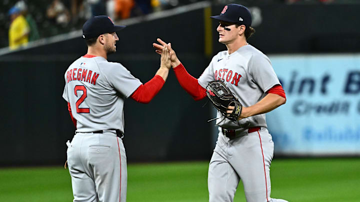 Boston Red Sox third baseman Alex Bregman celebrates the win against the Baltimore Orioles with outfielder Roman Anthony.