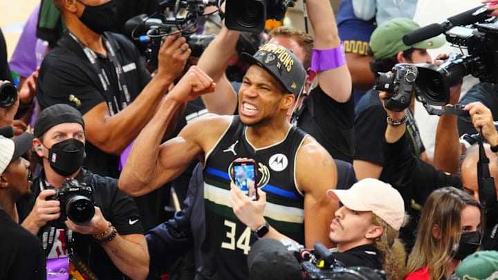 Jul 20, 2021; Milwaukee, Wisconsin, USA; Milwaukee Bucks forward Giannis Antetokounmpo (34) celebrates after winning game six of the 2021 NBA Finals and the championship against the Phoenix Suns at Fiserv Forum. Mandatory Credit: Mark J. Rebilas-Imagn Images Jul 20, 2021; Milwaukee, Wisconsin, USA; Milwaukee Bucks forward Giannis Antetokounmpo (34) celebrates after winning game six of the 2021 NBA Finals and the championship against the Phoenix Suns at Fiserv Forum. Mandatory Credit: Mark J. Rebilas-Imagn Images