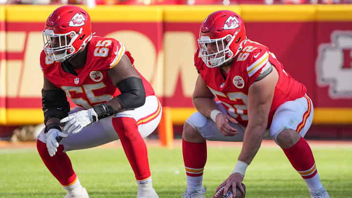 Nov 10, 2024; Kansas City, Missouri, USA; Kansas City Chiefs guard Trey Smith (65) and center Creed Humphrey (52) at the line of scrimmage against the Denver Broncos during the game at GEHA Field at Arrowhead Stadium. Mandatory Credit: Denny Medley-Imagn Images
