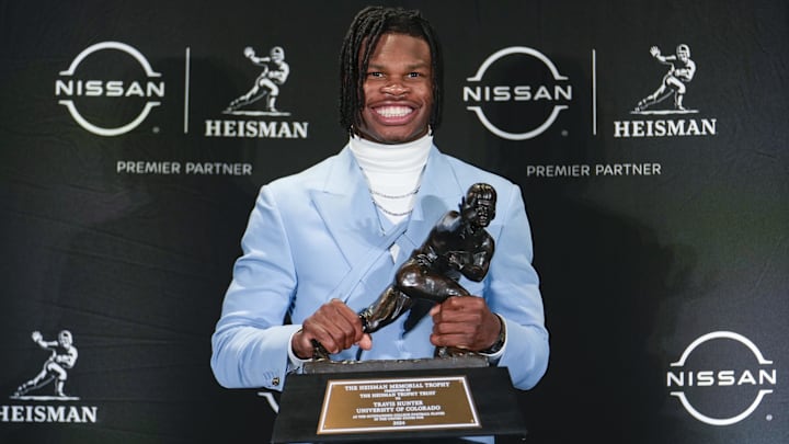Colorado Buffaloes wide receiver/cornerback Travis Hunter poses for a photo after winning the Heisman Trophy award during the 2024 Heisman Trophy Presentation.