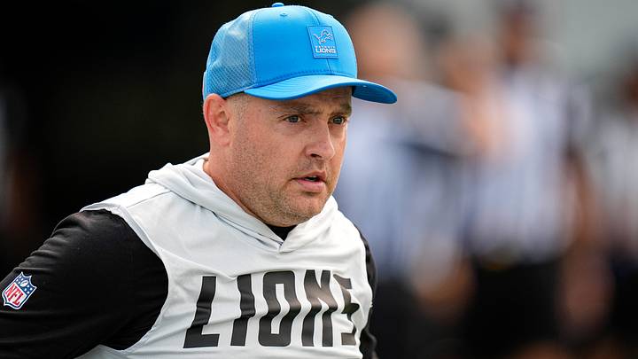 Detroit Lions offensive coordinator Drew Petzing walks onto the field for practice during training camp at Meijer Performance Center in Allen Park on Monday, August 10, 2026. Detroit Lions offensive coordinator Drew Petzing walks onto the field for practice during training camp at Meijer Performance Center in Allen Park on Monday, August 10, 2026.