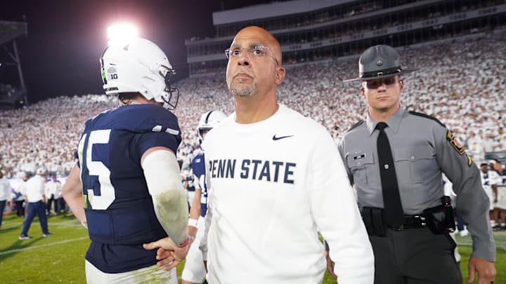Sep 27, 2025; University Park, Pennsylvania, USA; Penn State Nittany Lions head coach James Franklin and quarterback Drew Allar (15) react after losing to the Oregon Ducks at Beaver Stadium. Mandatory Credit: James Lang-Imagn Images
