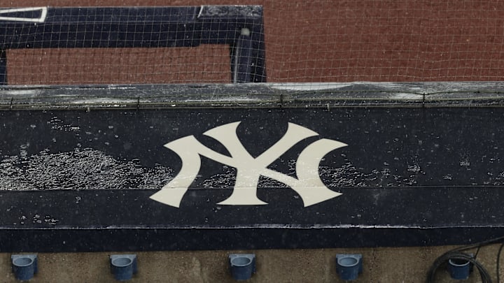 Aug 17, 2020; Bronx, New York, USA; A general view of rain falling on the New York Yankees logo on the first base dugout roof during a rain delay in the game between the New York Yankees and the Boston Red Sox. Mandatory Credit: Vincent Carchietta-Imagn Images Aug 17, 2020; Bronx, New York, USA; A general view of rain falling on the New York Yankees logo on the first base dugout roof during a rain delay in the game between the New York Yankees and the Boston Red Sox. Mandatory Credit: Vincent Carchietta-Imagn Images