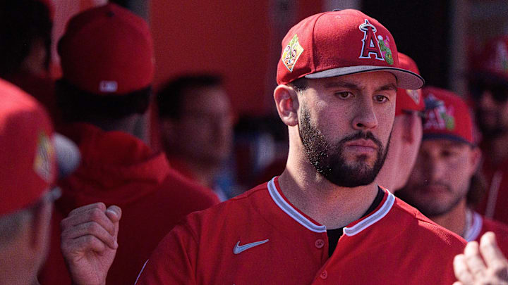 Feb 24, 2026; Tempe, Arizona, USA; Los Angeles Angels pitcher Grayson Rodriguez (21) reacts in the dugout with his team after being relieved in the second inning against the San Francisco Giants during a spring training game at Tempe Diablo Stadium. Mandatory Credit: Allan Henry-Imagn Images