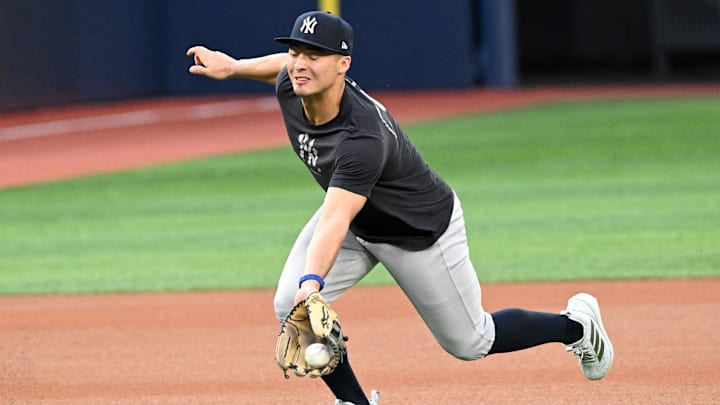 Oct 3, 2025; Toronto, Ontario, Canada; New York Yankees shortstop Anthony Volpe (11) fields the ball during workouts at Rogers Centre. Mandatory Credit: Dan Hamilton-Imagn Images