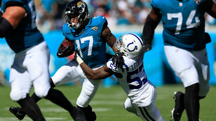 Jacksonville Jaguars tight end Evan Engram (17) is tackled by Indianapolis Colts linebacker Shaquille Leonard (53) during the third quarter of an NFL football matchup Sunday, Oct. 15, 2023 at EverBank Stadium in Jacksonville, Fla. The Jacksonville Jaguars defeated the Indianapolis Colts 37-20. [Corey Perrine/Florida Times-Union]