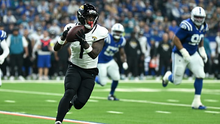 Dec 28, 2025; Indianapolis, Indiana, USA; Jacksonville Jaguars running back Travis Etienne Jr. (1) runs during the first half against the Indianapolis Colts at Lucas Oil Stadium. Mandatory Credit: Robert Goddin-Imagn Images