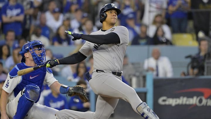 Oct 26, 2024; Los Angeles, California, USA; New York Yankees outfielder Juan Soto (22) hits a solo home run in the third inning against the Los Angeles Dodgers during game two of the 2024 MLB World Series at Dodger Stadium. Oct 26, 2024; Los Angeles, California, USA; New York Yankees outfielder Juan Soto (22) hits a solo home run in the third inning against the Los Angeles Dodgers during game two of the 2024 MLB World Series at Dodger Stadium.