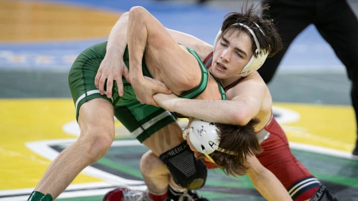 Lacey Township’s Killian Coluccio, right, competes against Delbarton’s Peter Terranova in a 106-pound quarterfinal match during the NJSIAA individual wrestling championship tournament at Boardwalk Hall in Atlantic City on March 7 during the 2024-25 season.