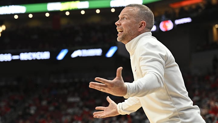 Dec 3, 2024; Louisville, Kentucky, USA;  Louisville Cardinals head coach Pat Kelsey reacts during the first half against the Mississippi Rebels at KFC Yum! Center. Mandatory Credit: Jamie Rhodes-Imagn Images