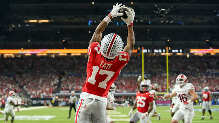 Ohio State Buckeyes wide receiver Carnell Tate (17) makes a catch for a touchdown Saturday, Dec. 6, 2025, during the Big Ten football championship against the Indiana Hoosiers at Lucas Oil Stadium in Indianapolis.