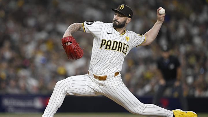 Oct 2, 2024; San Diego, California, USA; San Diego Padres pitcher Tanner Scott (66) throws during the sixth inning of game two in the Wildcard round for the 2024 MLB Playoffs against the Atlanta Braves at Petco Park. Mandatory Credit: Denis Poroy-Imagn Images