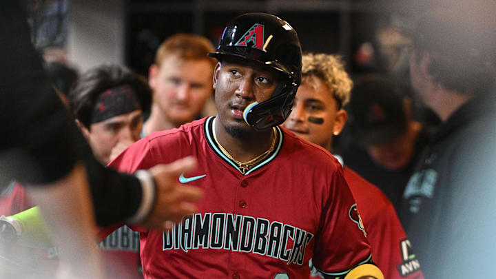 Sep 20, 2024; Milwaukee, Wisconsin, USA; Arizona Diamondbacks shortstop Geraldo Perdomo (2) celebrates in the dugout after hitting a home run against the Milwaukee Brewers in the fifth inning at American Family Field. Mandatory Credit: Michael McLoone-Imagn Images Sep 20, 2024; Milwaukee, Wisconsin, USA; Arizona Diamondbacks shortstop Geraldo Perdomo (2) celebrates in the dugout after hitting a home run against the Milwaukee Brewers in the fifth inning at American Family Field. Mandatory Credit: Michael McLoone-Imagn Images