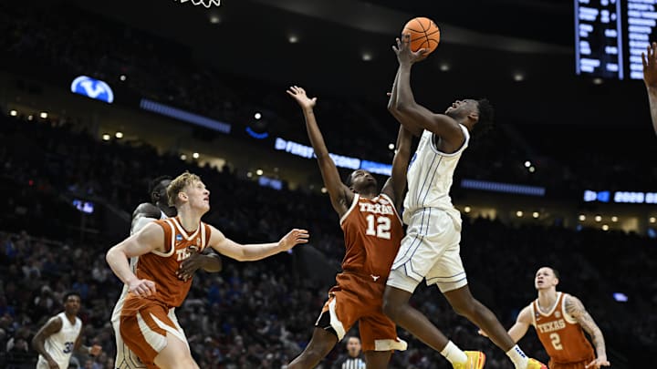 Mar 19, 2026; Portland, OR, USA; BYU Cougars forward AJ Dybantsa (3) shoots against Texas Longhorns guard Tramon Mark (12) in the second half during a first round game of the men's 2026 NCAA Tournament at Moda Center. Mandatory Credit: Troy Wayrynen-Imagn Images Mar 19, 2026; Portland, OR, USA; BYU Cougars forward AJ Dybantsa (3) shoots against Texas Longhorns guard Tramon Mark (12) in the second half during a first round game of the men's 2026 NCAA Tournament at Moda Center. Mandatory Credit: Troy Wayrynen-Imagn Images