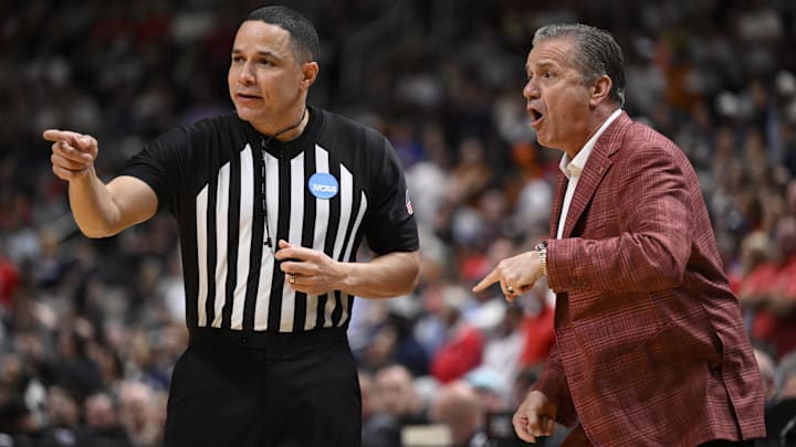 Arkansas head coach John Calipari talks to a referee against Arizona in the first half during a Sweet 16 game of the West Regional of the men's 2026 NCAA Tournament at SAP Center. 