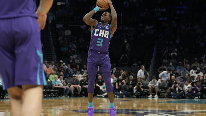 Mar 21, 2022; Charlotte, North Carolina, USA; Charlotte Hornets guard Terry Rozier (3) attempts a three-point shot against the New Orleans Pelicans during the first quarter at Spectrum Center. Mandatory Credit: Jim Dedmon-Imagn Images