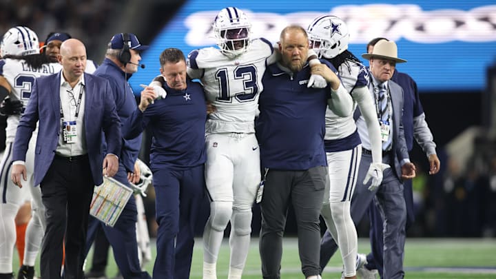 Dallas Cowboys linebacker DeMarvion Overshown (13) is helped off the field after an injury in the second half against the Cincinnati Bengals.