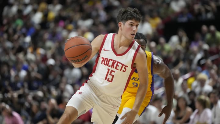 Jul 12, 2024; Las Vegas, NV, USA; Houston Rockets guard Reed Sheppard (15) dribbles the ball against Los Angeles Lakers guard Bronny James (9) during the first half at the Thomas & Mack Center. Mandatory Credit: Lucas Peltier-USA TODAY Sports Jul 12, 2024; Las Vegas, NV, USA; Houston Rockets guard Reed Sheppard (15) dribbles the ball against Los Angeles Lakers guard Bronny James (9) during the first half at the Thomas & Mack Center. Mandatory Credit: Lucas Peltier-USA TODAY Sports