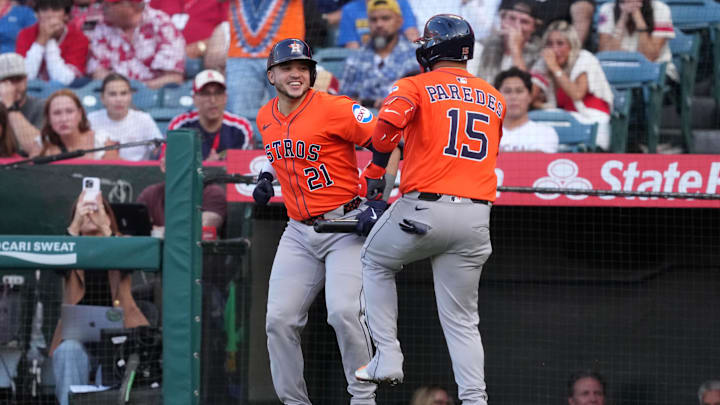 Jun 20, 2025; Anaheim, California, USA; Houston Astros third baseman Isaac Paredes (15) celebrates with catcher Yainer Diaz (21) after hitting a home run in the first inning against the Los Angeles Angels at Angel Stadium. Mandatory Credit: Kirby Lee-Imagn Images